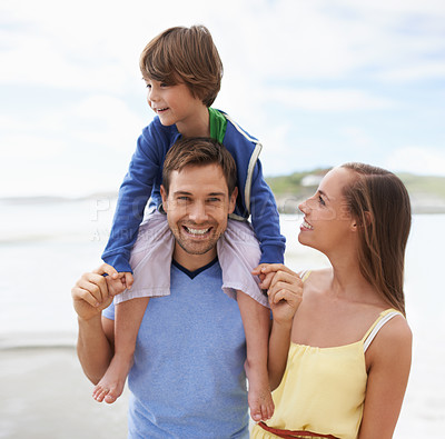 Buy stock photo Family, portrait and fun while together at beach for travel holiday in summer with a smile. Man, woman and child or son walking outdoor on vacation or adventure at sea with happiness, love and care