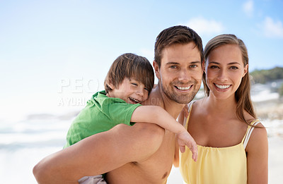 Buy stock photo Beach, summer and portrait of a family on vacation, travel or fun trip with a smile. Man, woman and child or son together on holiday or adventure at sea with happiness, love and care on blue sky