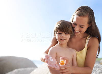 Buy stock photo Sunscreen, beach and summer with a child and mother outdoor with sun protection on travel holiday. Woman and kid or family together on vacation at sea with blue sky, skincare lotion and mockup space