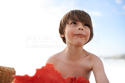 Buy stock photo Child, kid and eating watermelon at beach on vacation, holiday or travel by ocean in summer. Hungry boy, food or fruit at sea outdoor at picnic, nutrition or thinking of healthy diet on mockup space