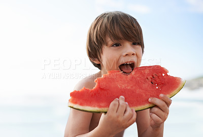 Buy stock photo Child, boy and eating watermelon at beach on vacation, holiday or travel by ocean in summer. Hungry kid, food or fruit at sea outdoor for adventure, nutrition and vitamin c for healthy diet on mockup