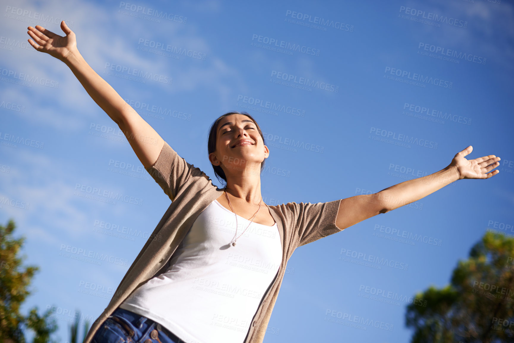 Buy stock photo A young woman enjoying the outdoors