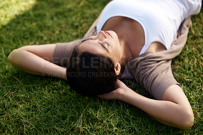 Buy stock photo Relax, sleep and woman on grass of field, nature or park outdoor in summer for fresh air or free time. Environment, peace and wellness with calm young person lying on lawn in backyard to rest