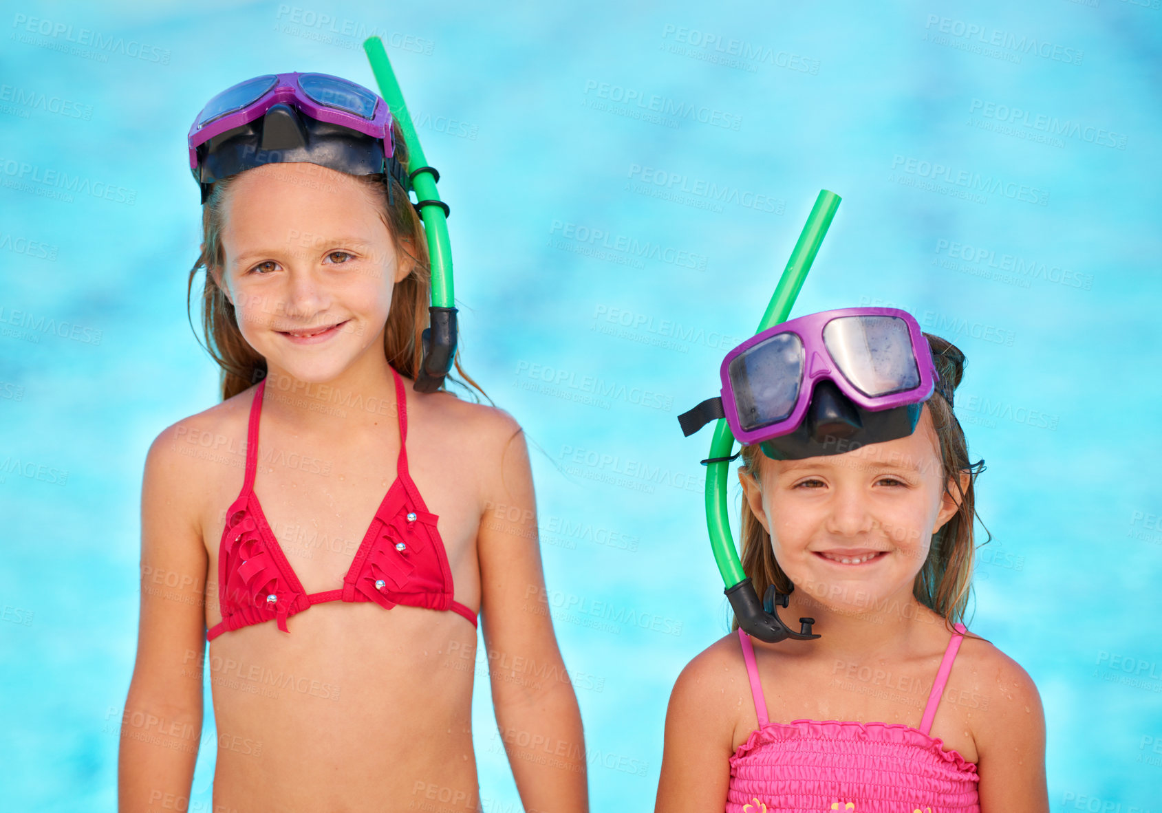 Buy stock photo Two cute little girls in their swimsuits at the pool