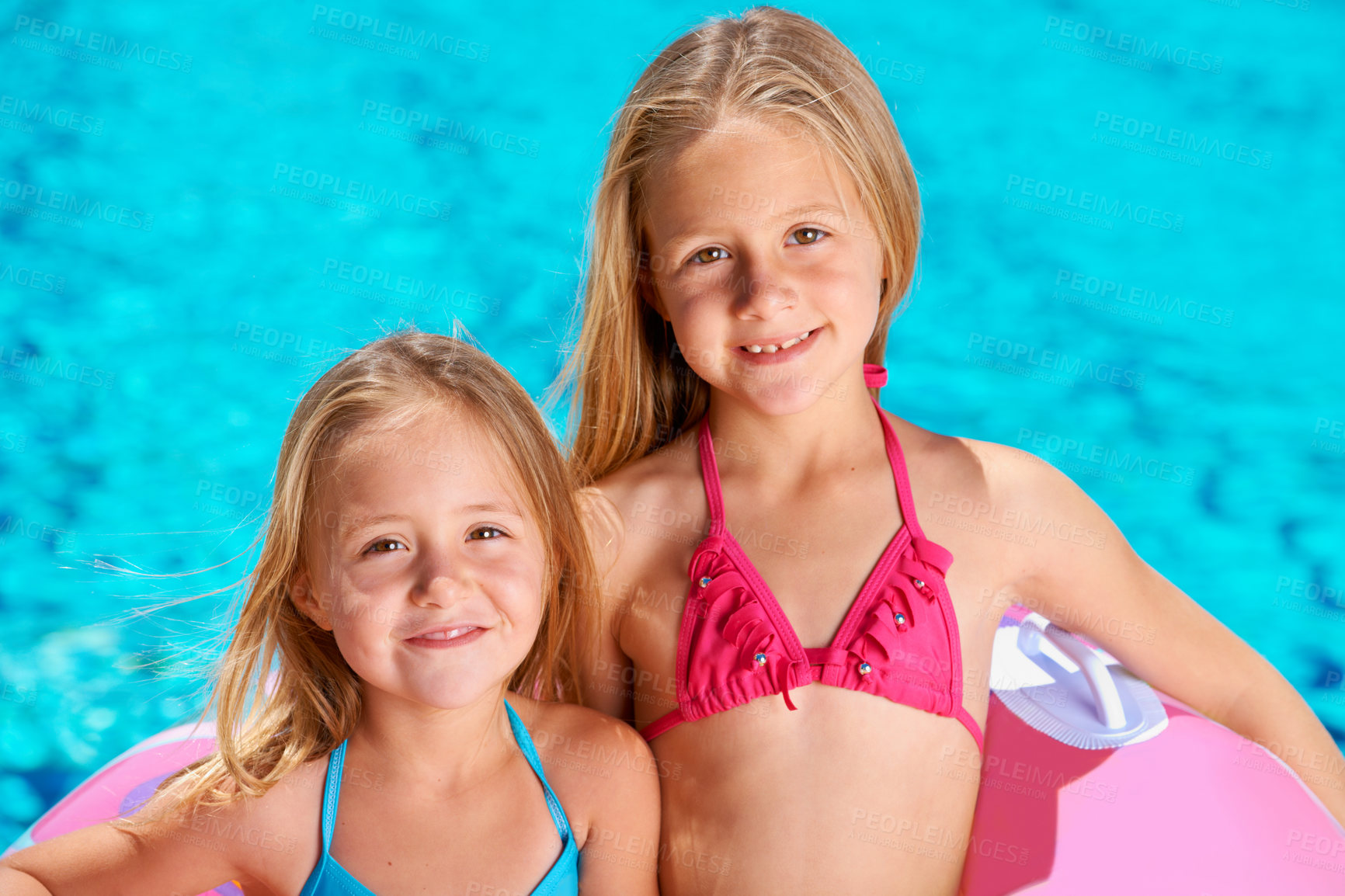 Buy stock photo Summer, portrait and kids with inflatables at swimming pool for adventure at resort on vacation. Holiday, games or friends relax together with toys for fun in water, activity or children with fashion