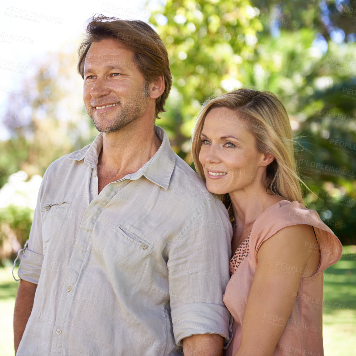 Buy stock photo Shot of an affectionate mature couple  enjoying a day in the park