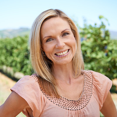 Buy stock photo Portrait of a mature woman  enjoying a day in the vineyards