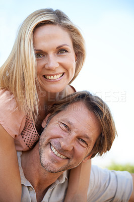 Buy stock photo Piggyback, nature and portrait of couple in park hugging for love, care and marriage on vacation. Happy, outdoor and man and woman embracing in garden on holiday or weekend trip for romantic date.