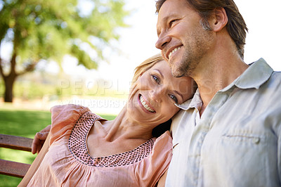 Buy stock photo Happy, bench and portrait of couple in park for bonding, relationship and love outdoors. Nature, marriage and face of man and woman embrace for romance, relax and commitment on weekend together