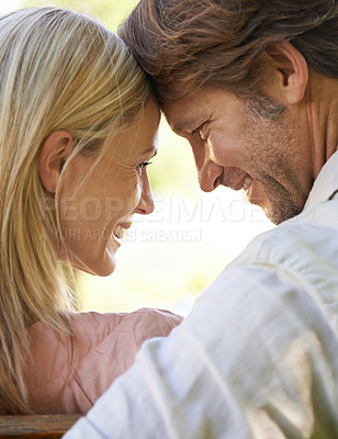 Buy stock photo Couple, forehead touch and care in outdoors, love and connection in relationship or security. Mature people, back and date in nature or romance in garden, closeup and vacation or support on holiday