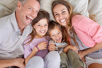 Buy stock photo Shot of a happy young family playing together