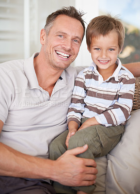 Buy stock photo Portrait of a father and son sitting together