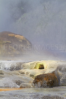 Buy stock photo Fog, rocks and ocean in nature for environment, beach and geography on earth for mountain outdoor. Cloud, sky and landscape for mist and ecology with moss in weather for serene and tranquil for eco
