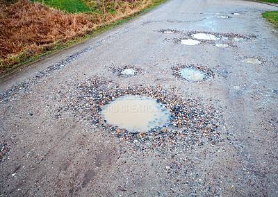 Buy stock photo Water, gravel and road in countryside with pothole with maintenance, infrastructure and farm transport in winter. Dirt, path and rain puddle in hole on rural street with damage, ground and nature.