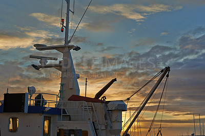 Buy stock photo Ship, sunset and harbor at sea to travel with closeup, clouds and transportation for vacation sailing. Ship, dock and ocean with yacht for tourism, holiday and adventure with sunrise, sky and nature