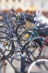 A lens blurred photo of lots of parked bikes. Symbolic content.
