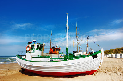 Buy stock photo Beach, land and fishing boat on sand outdoor in nature by sea for travel in summer. Ship, transport and vessel on landscape, seashore or dock at harbor for sailing on journey by ocean in Australia