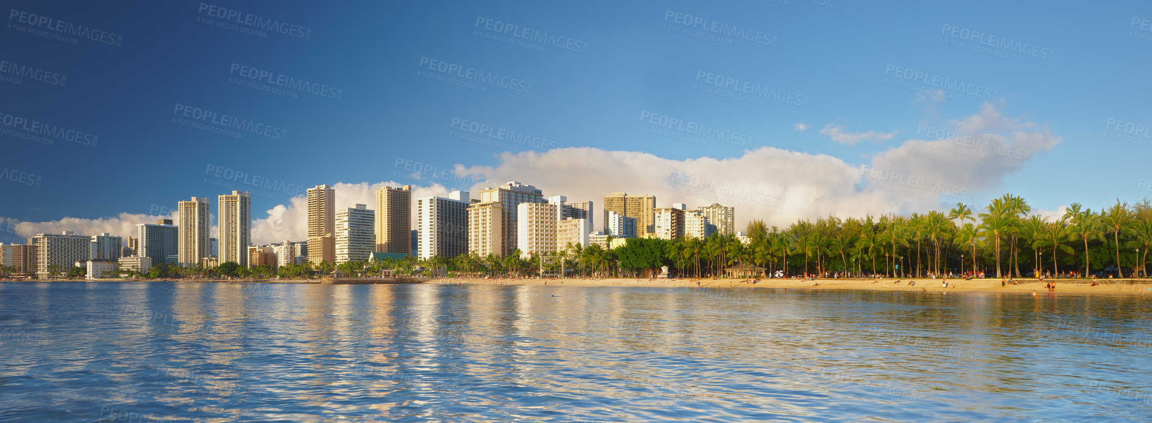 Buy stock photo Ocean, city and buildings with landscape panorama, travel destination with skyscraper and outdoor. Urban development, architecture and environment for tourism, adventure and location with blue sky