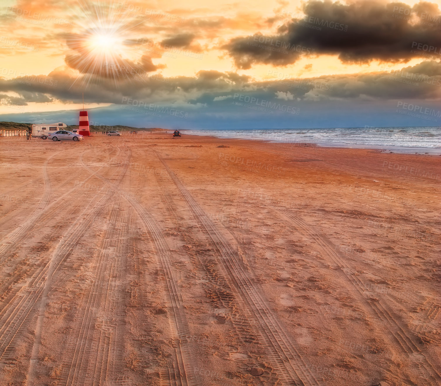 Buy stock photo Ocean, sunrise and clouds in blue sky with waves, water and sand in seaside. Tourist, destination and vacation for summer beach, landscape and environment with cars for holiday or travel to swim