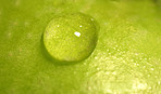 Macro photo of water drop on an apple