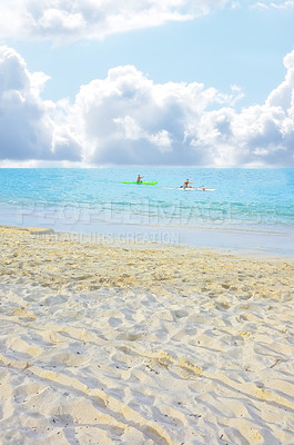Buy stock photo People in ocean, kayak and beach for vacation in Hawaii, nature and environment with gold sand for travel. Adventure, sports and fun in sea with coastline or shore, clouds and blue sky in summer
