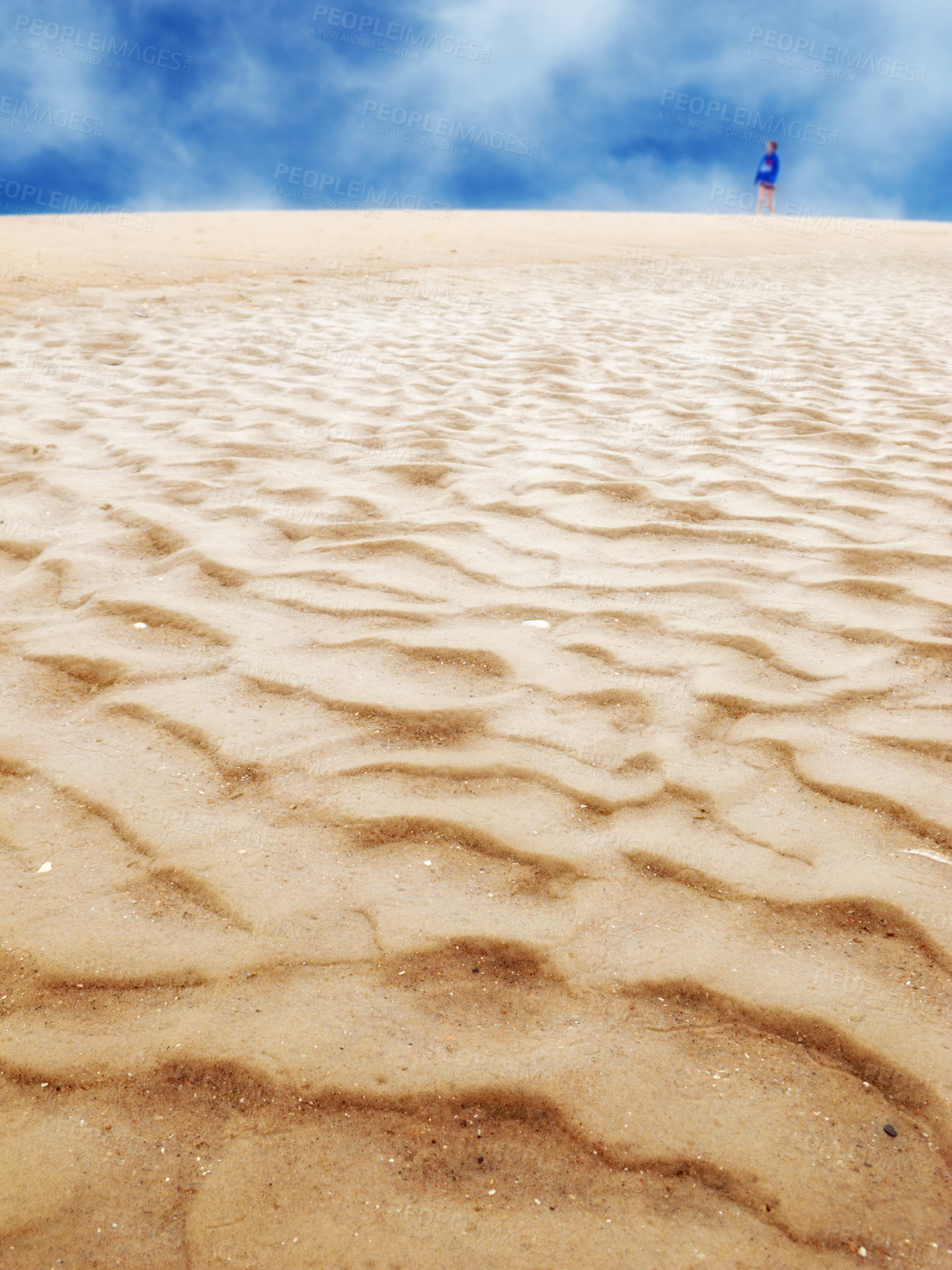 Buy stock photo Desert, landscape and clouds in blue sky with person on sand in arid, barren or dry environment. Travel, nature or soil and summer horizon in hot climate or drought with banner, mockup or space