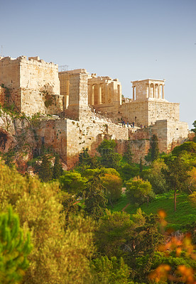 Buy stock photo Athens, Greece and building with trees in sunlight, ancient architecture of history site in summer. Marble, stone temple in greek culture with forest landscape, Europe and valley to travel location 