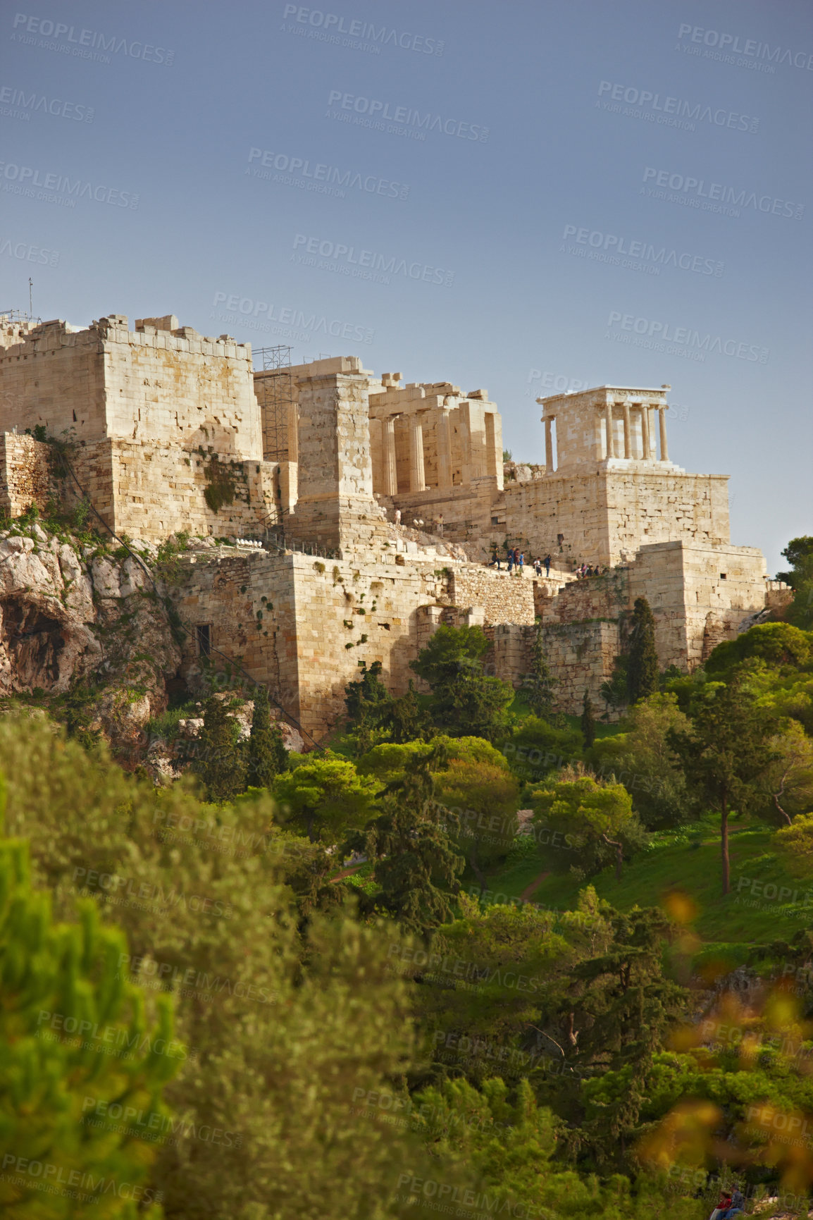 Buy stock photo Architecture, artistic building and history of parthenon in Athens Acropolis with trees, nature and grass in Greece. Traditional temple, design and walls in landscape blue sky, rocks and marble