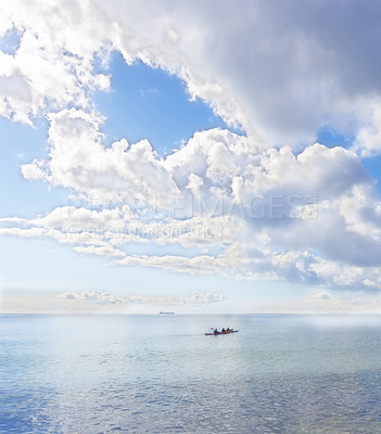 Buy stock photo Ocean, blue sky and people on kayak for adventure, sports and travel on natural background or landscape. Sea, fresh air and clouds with calm water, boat on journey and recreation activity for holiday