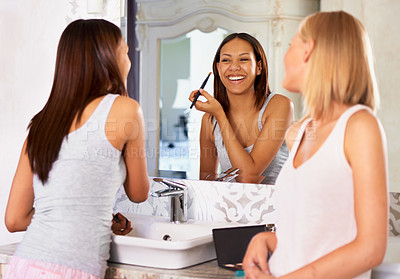 Buy stock photo Bathroom, mirror and friends with makeup or cosmetics in morning, routine and getting ready together. Women, beauty and happy reflection of girl with brush on face to apply powder or eyeshadow