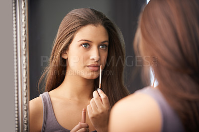 Buy stock photo Woman, thinking and lip gloss in mirror for makeup, application and getting ready for wellness in bedroom. Mouth, shine and thoughtful person with cosmetics, beauty product and self care in home