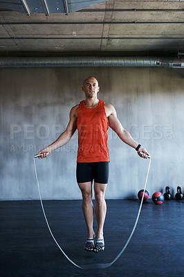 Buy stock photo Fitness, jump rope and portrait of man doing gym training, cardio endurance challenge or exercise performance. Skipping, active lifestyle and male sports person doing jumping workout