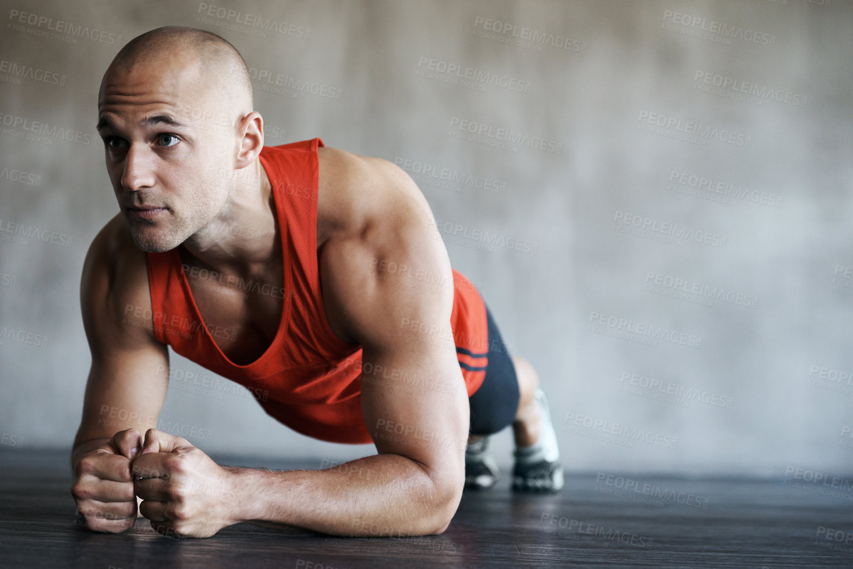 Buy stock photo Fitness, man and plank in workout, exercise or training for strong core, abs or determination at gym. Serious, fit and confident male personal trainer working on abdominal muscle for healthy wellness