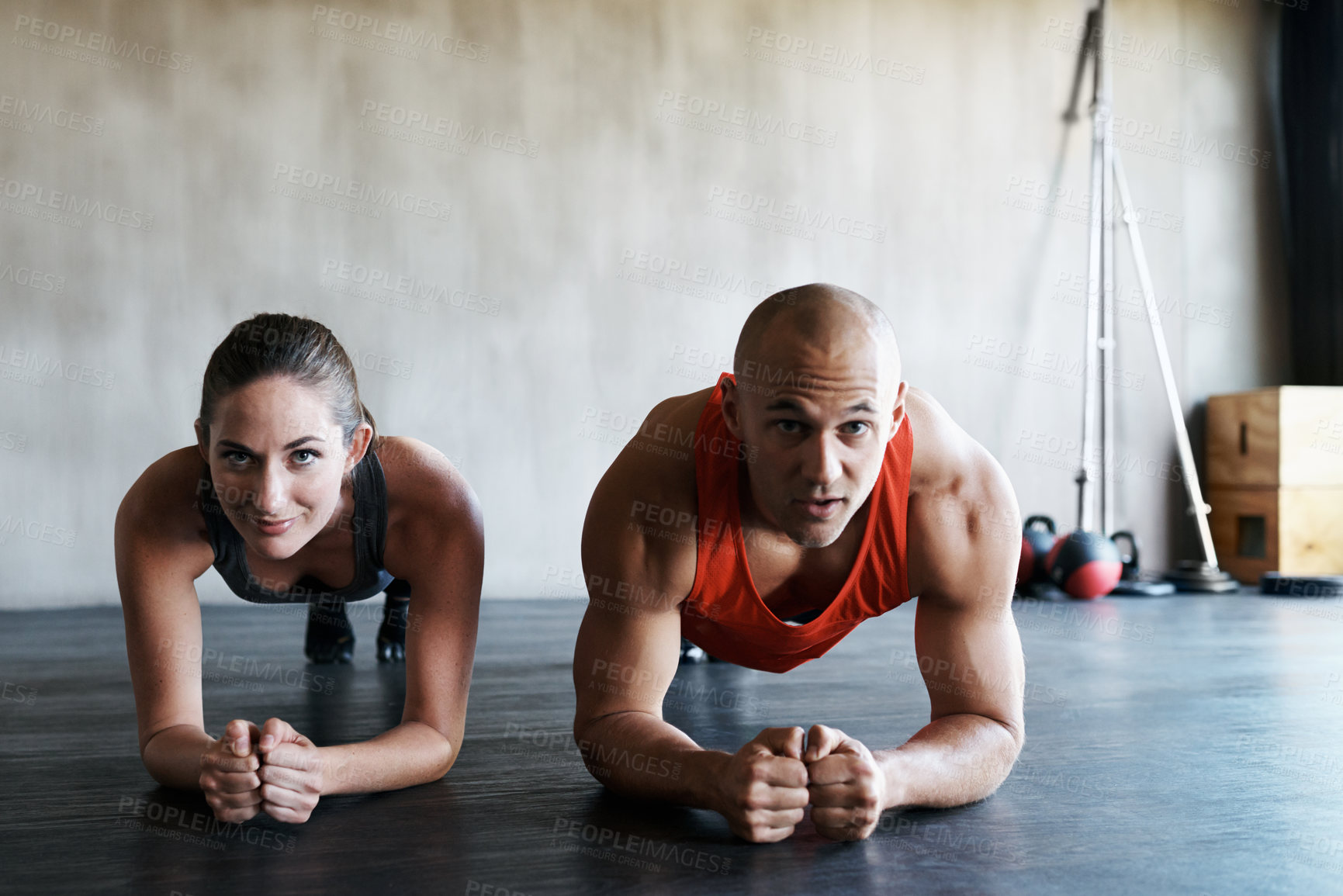 Buy stock photo Gym floor, portrait and people doing plank challenge, fitness club commitment or core strength building. Balance, teamwork and athlete man, woman or partnership team concentrate on muscle workout