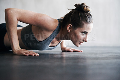 Buy stock photo Fitness, pushup and woman on a floor for training, cardio and endurance at gym. Lifting, exercise and female athlete at a health center for core, strength and ground workout with determined mindset