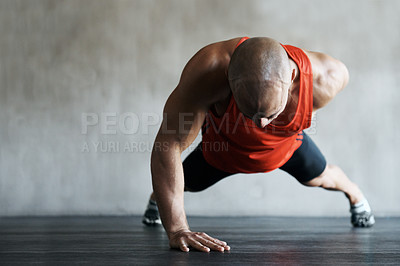 Buy stock photo Shot of a man working out at the gym
