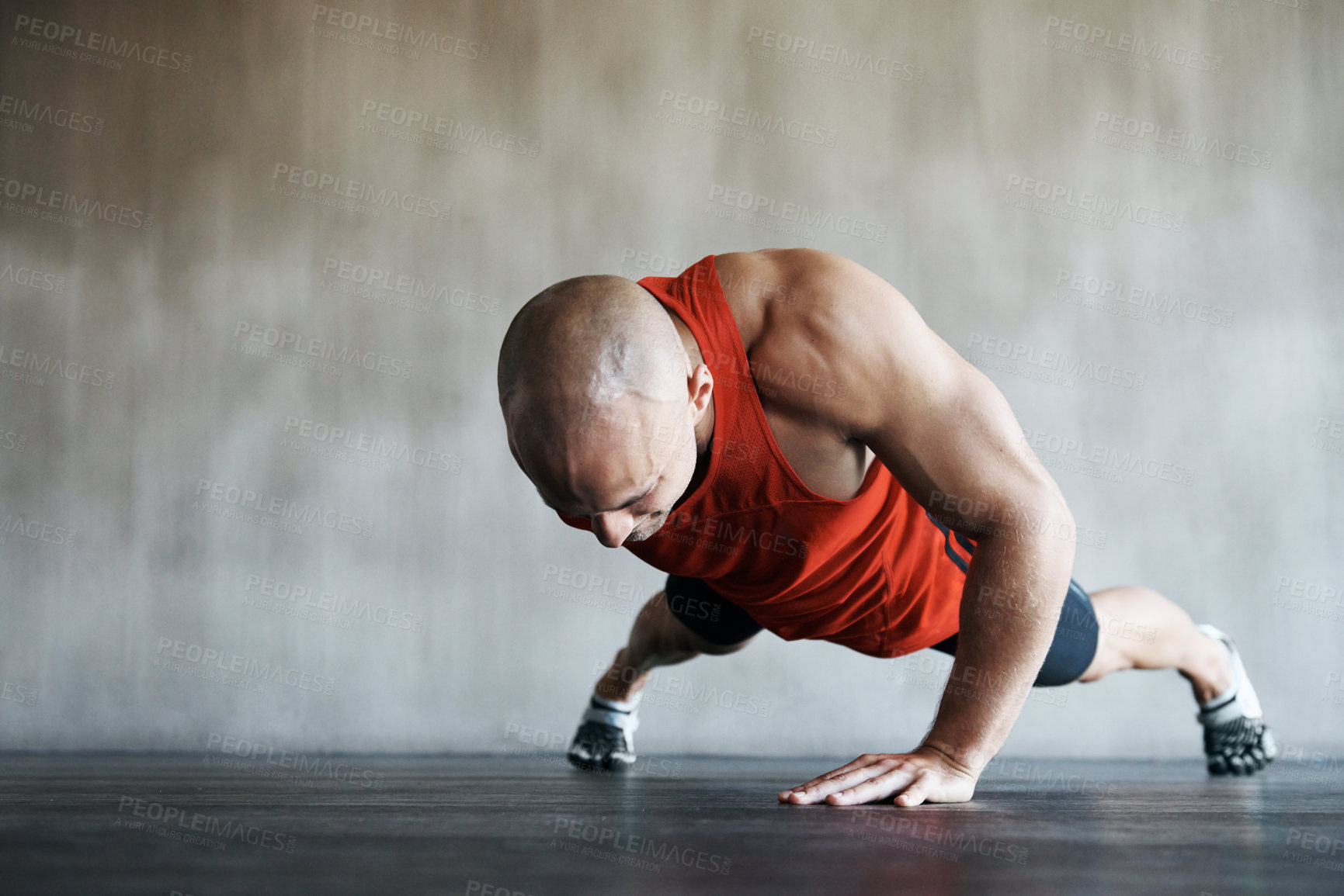 Buy stock photo Gym, man and one arm push up for exercise performance, workout determination and sports training focus. Athlete discipline, strength endurance mockup or active male person concentrate on floor pushup