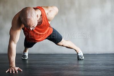 Buy stock photo Shot of a man working out at the gym