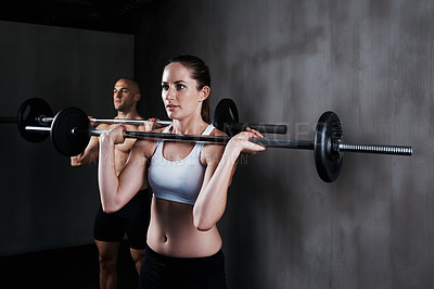 Buy stock photo Fitness, people and weightlifting with barbell for serious exercise, bodybuilding or workout at gym. Fit, active and strong woman and man lifting weight for intense strength, arm muscle or training