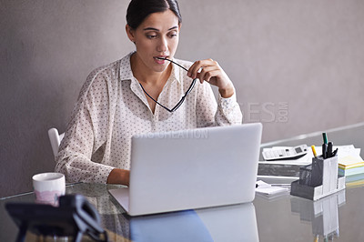 Buy stock photo Shot of a beautiful young business woman thinking at her desk