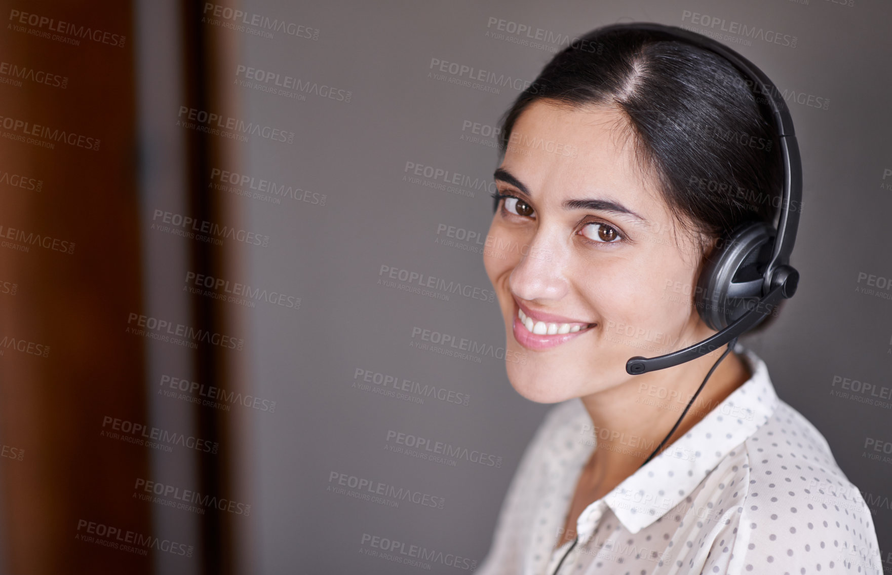Buy stock photo Shot of an attractive young call centre operator