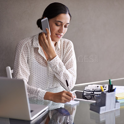 Buy stock photo Businesswoman, phone call and office with laptop, desk and cellphone in meeting. Technology, computer and writing notes for financial advisor, manager and communication with client for budget