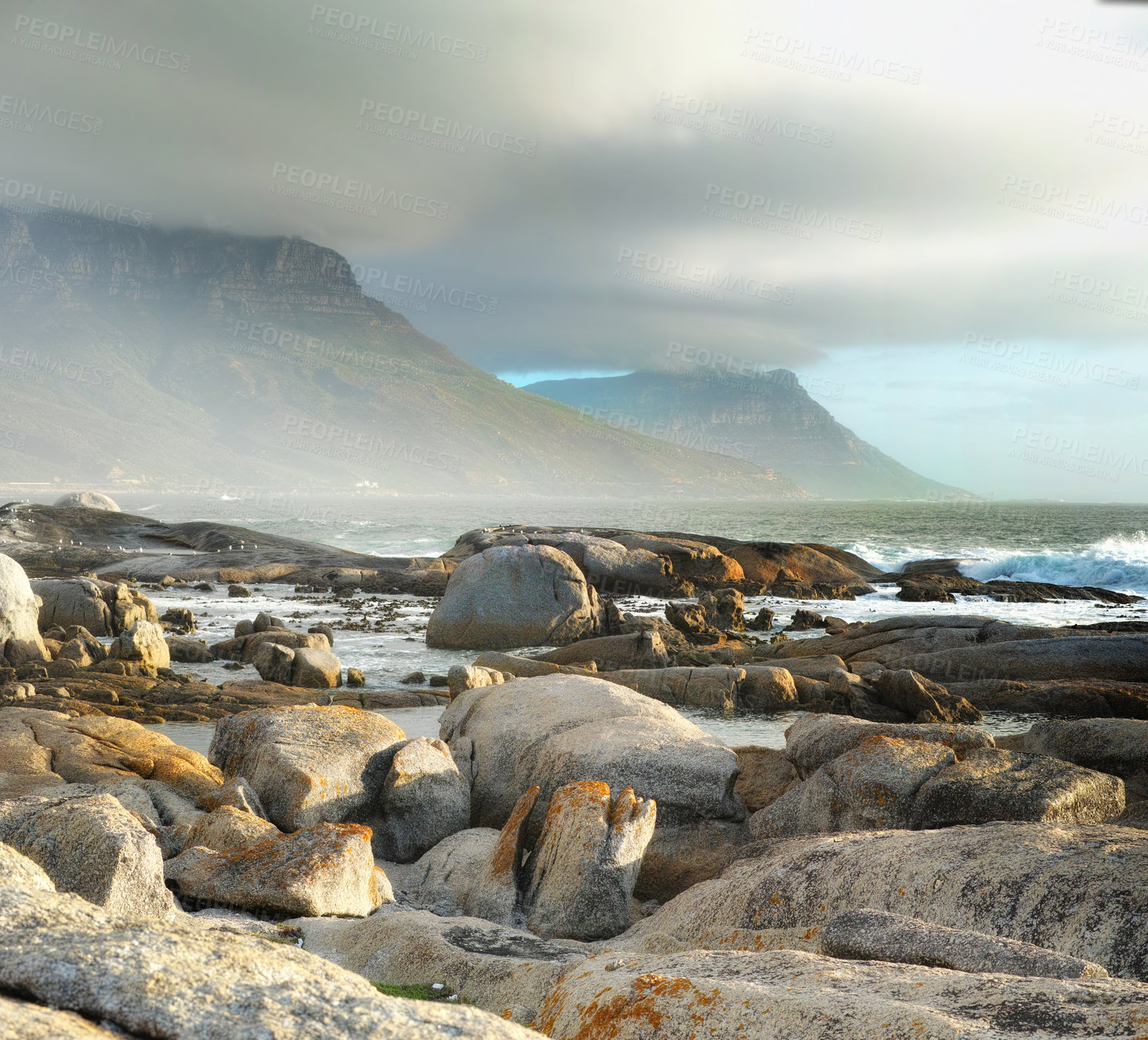Buy stock photo Sea, rocks and landscape with beach and travel destination, waves and summer vacation in Cape Town. Environment, ocean view and seaside location with mountain and clouds, nature and adventure outdoor