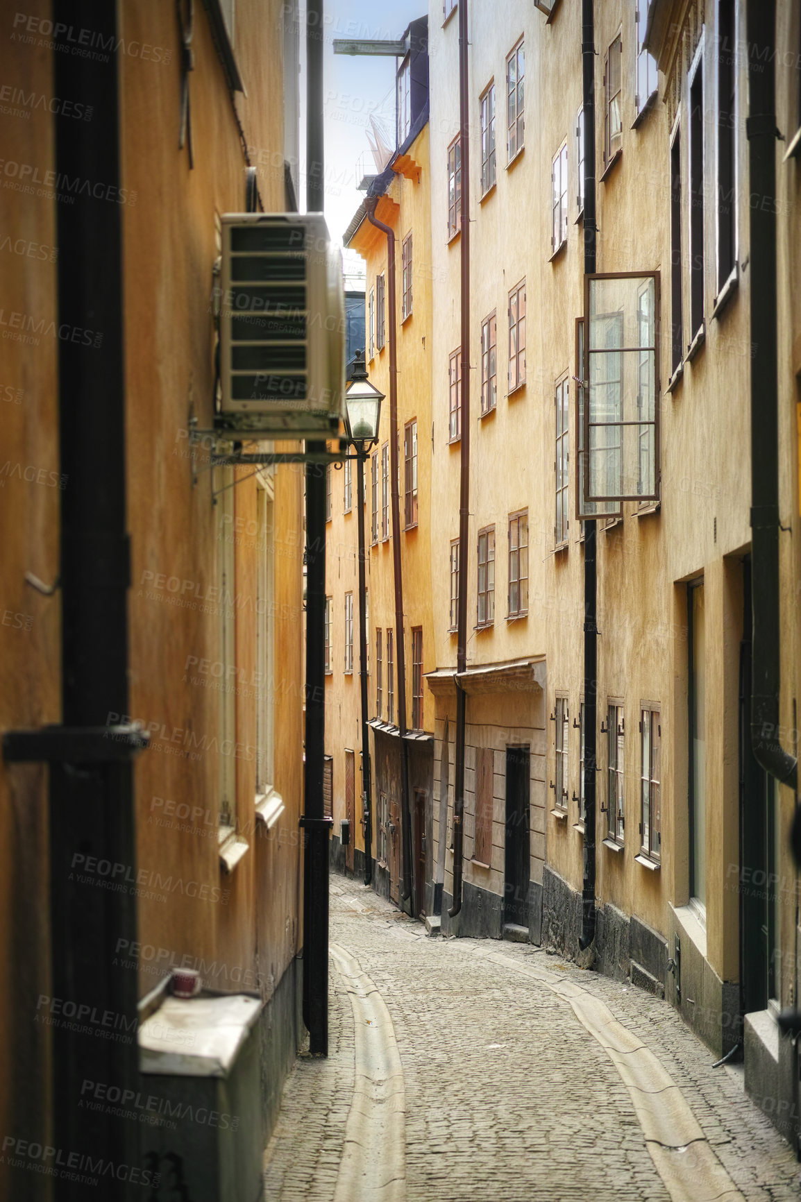 Buy stock photo Travel, architecture and alley in vintage city with history, culture or holiday destination in Sweden. Vacation, old buildings and antique stone street in Stockholm with cobble path in ancient town