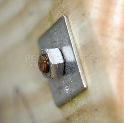 Buy stock photo Bolt, plate and steel tool for maintenance in architecture, construction or woodwork with blurred background. Manufacturing, closeup and metal equipment for building industry and home improvement nut