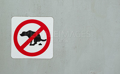 Buy stock photo No dog poop or pet excrement allowed symbol and illustration. Information sign on a grey wall with copyspace showing warning of dogs pooping. Domestic canine animals forbidden from excreting in area.
