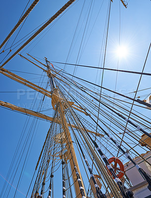 Buy stock photo Sailing, ship and mast outdoor with rope for travel, journey and low angle of blue sky in summer. Boat, wood pole and vintage schooner vessel on a cruise, rigging and transportation with sunshine