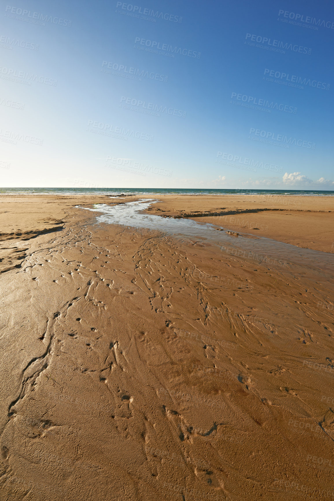 Buy stock photo Beach, sand and water from river, ocean and scenic landscape in natural environment. Fresh water, estuary and lagoon in Denmark, holiday or summer vacation and rural outdoor conservation area