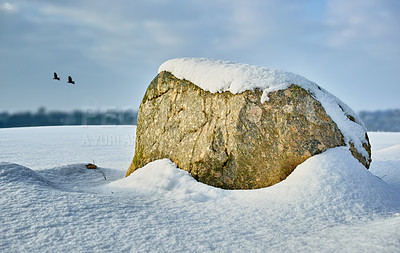 Buy stock photo Rock, nature and snow with landscape or environment, cold weather and blue sky with travel in Denmark. Natural background,  tourism with location or destination, icy ground and frozen outdoor