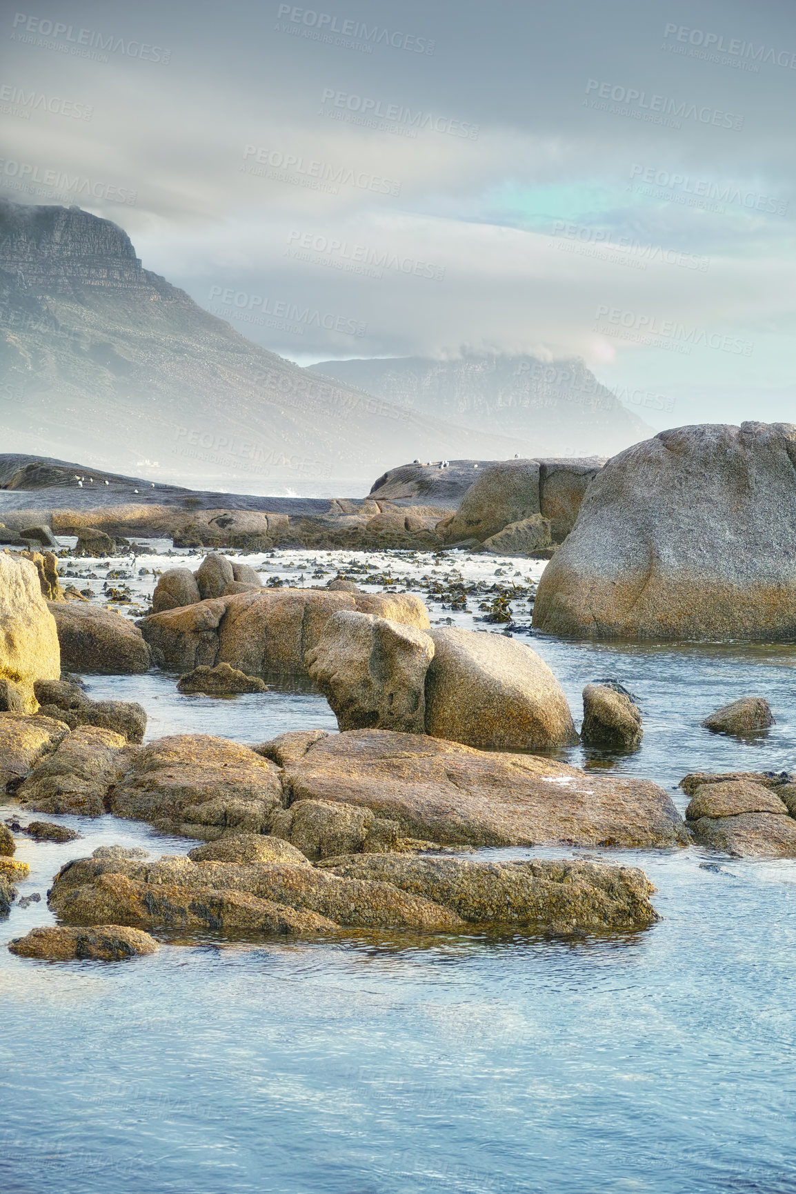 Buy stock photo Ocean, rocks and landscape with beach and outdoor, travel with summer vacation in South Africa. Environment, seaside location and tropical destination with journey to sea and nature with adventure